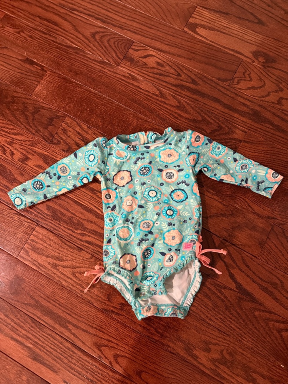 Ruffle Butts Turquoise Floral Long-Sleeve One Piece Swimsuit with Pink Ties